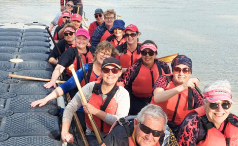 Group of people participating in dragon boat racing at Warriors Albury and Wodonga Dragon Boat Club 