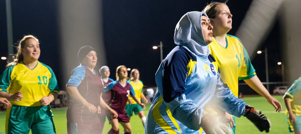 Emine playing soccer  