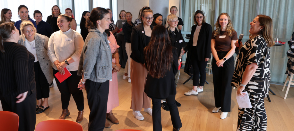Large group of women conversing  